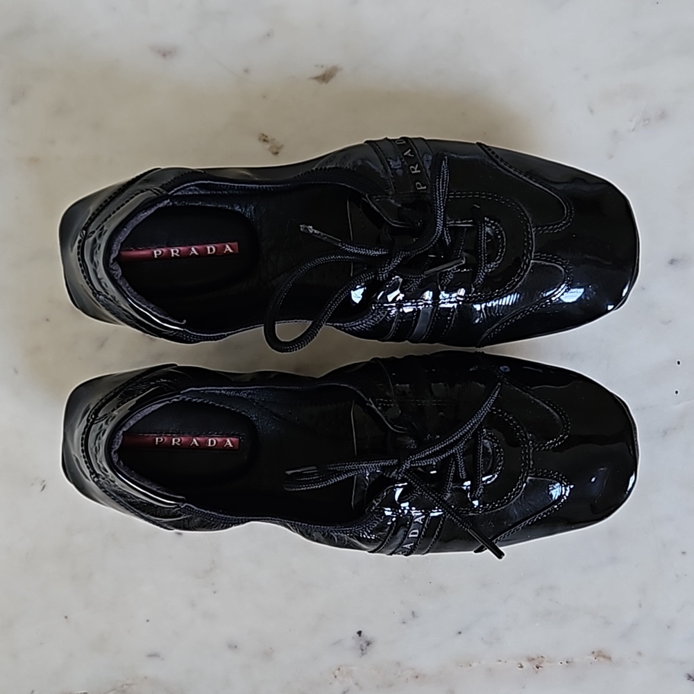 PRADA: Buffalo Dance black patent leather flats